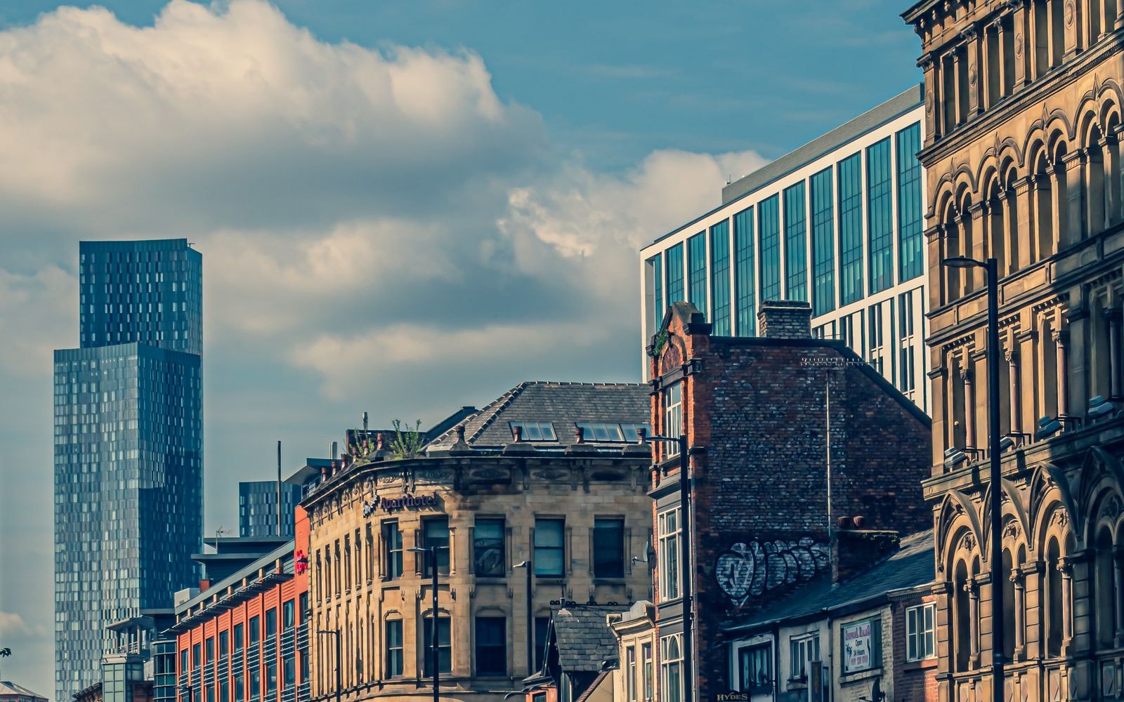 Northern UK city street with local businesses